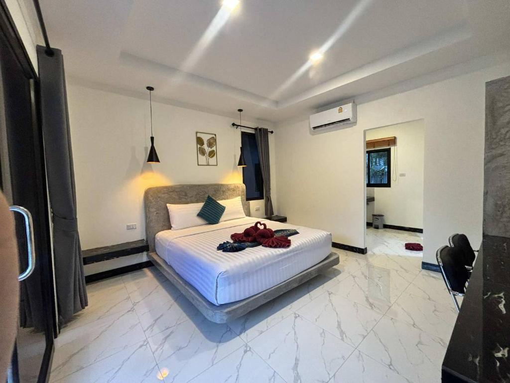 Ένα ή περισσότερα κρεβάτια σε δωμάτιο στο Lanta Buddy Resort