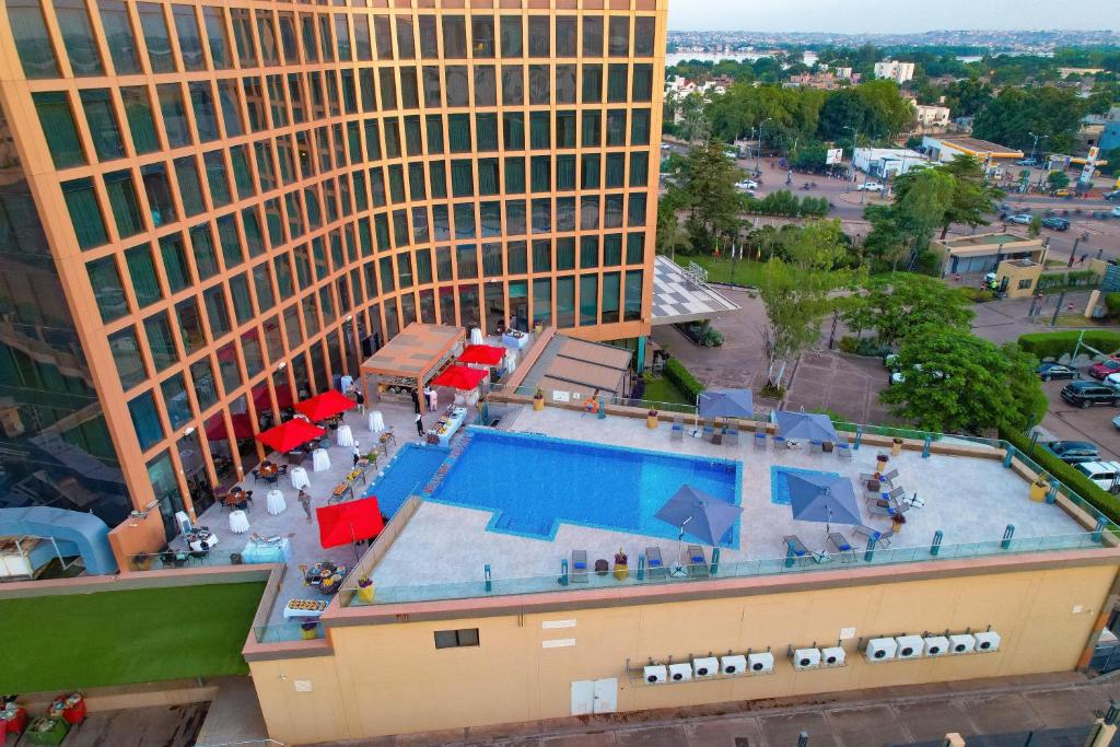 an overhead view of a building and a swimming pool at Radisson Collection Hotel Bamako in Bamako