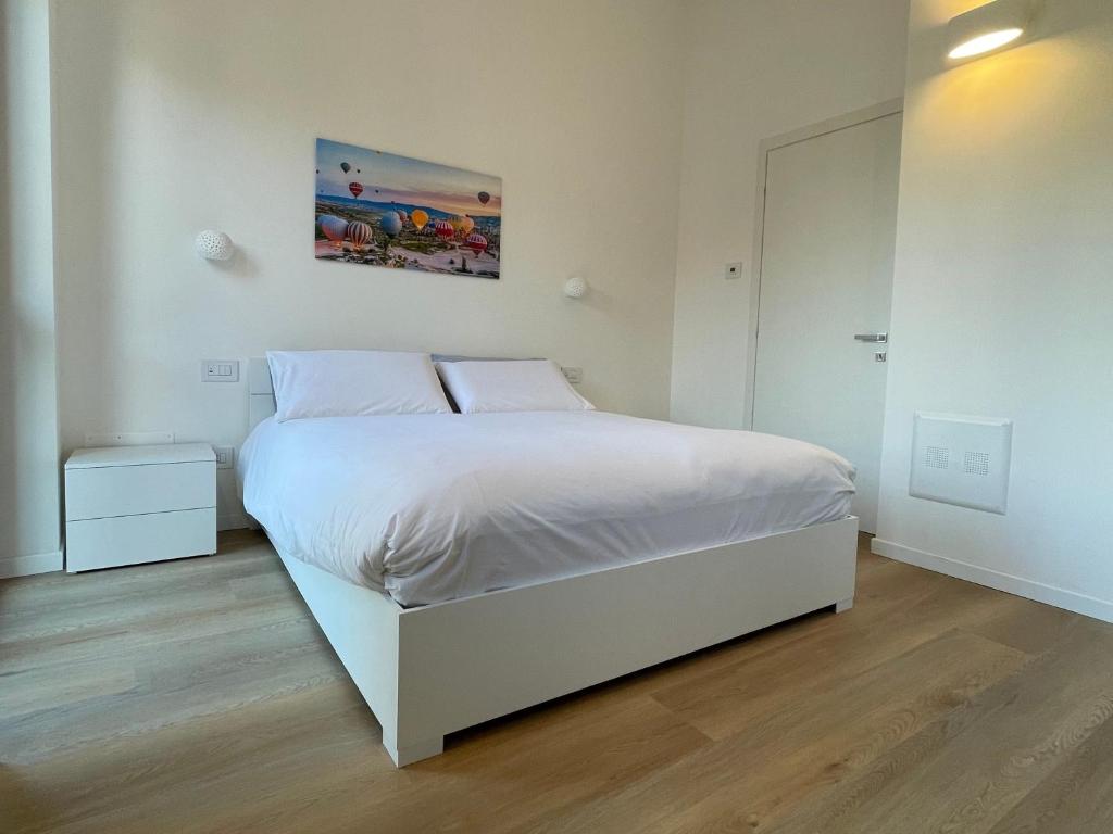 Ένα ή περισσότερα κρεβάτια σε δωμάτιο στο Serendipity Guest Rooms - Foresteria Lombarda