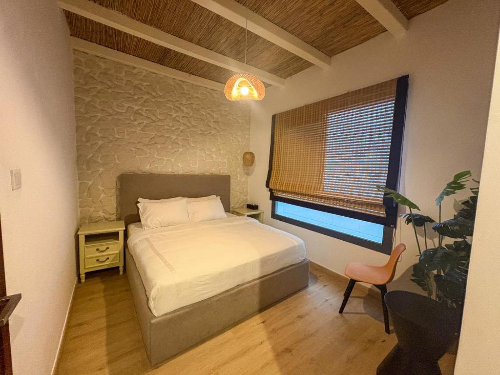 Ένα ή περισσότερα κρεβάτια σε δωμάτιο στο Jungle Breeze Villa, Al Dana Villas