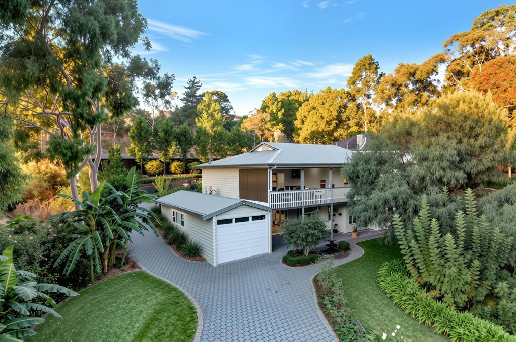 an aerial view of a house with a garden at Luxury Resort Studio Apartment Retreat with Pool, Tennis & Alfresco 
