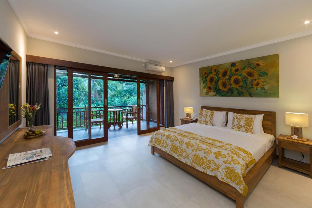 Postel nebo postele na pokoji v ubytování Alamdini Resort Ubud