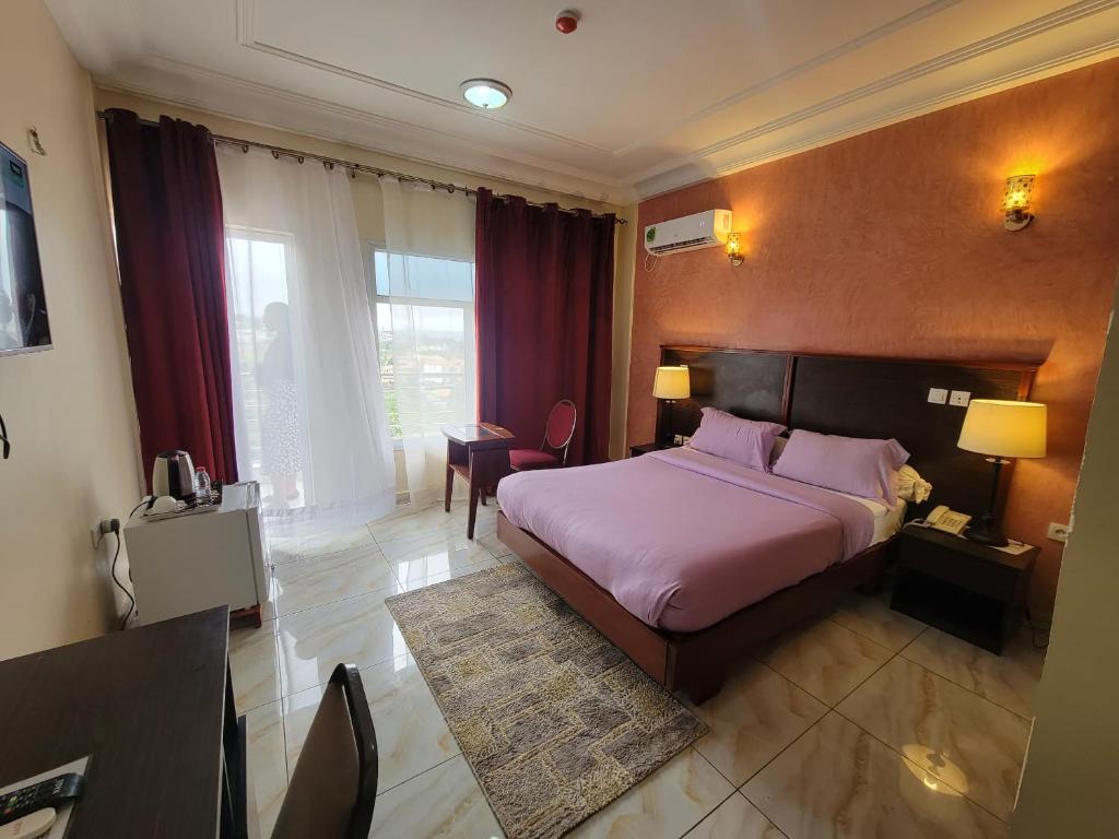 Ένα ή περισσότερα κρεβάτια σε δωμάτιο στο Safyad Hotel