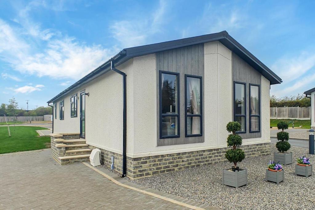 a small white house with black windows at 2 Bed in Evesham oc-f33689 in Offenham