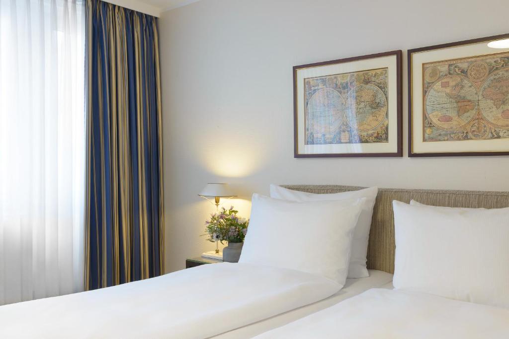 Postel nebo postele na pokoji v ubytování Hotel Stella Maris