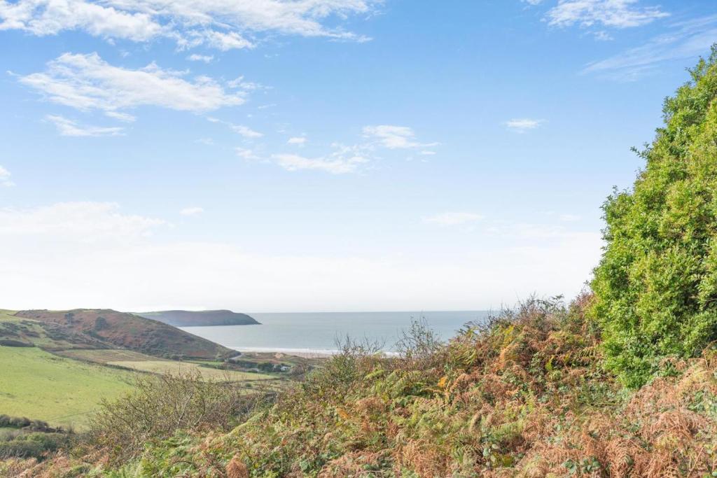 a view of the ocean from a hill at 4 Bed in Woolacombe oc-h33441 in Mortehoe