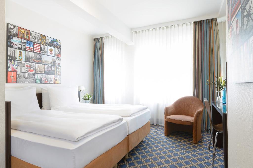 Postel nebo postele na pokoji v ubytování Hotel Stella Maris