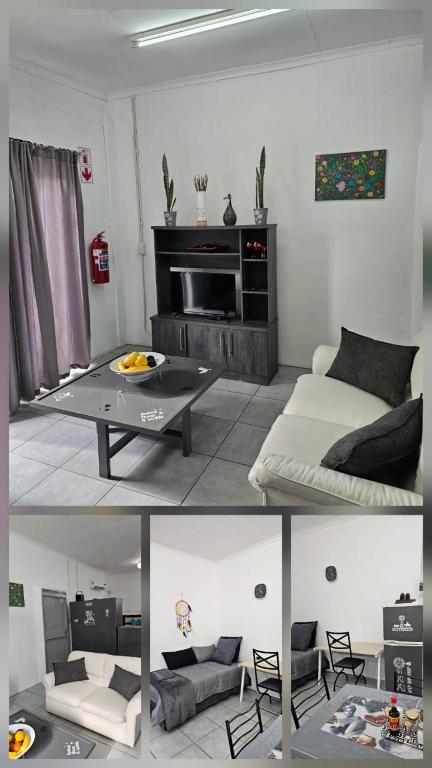 a living room with a bed and a table at Lalapanzi Accommodation in Olifantshoek