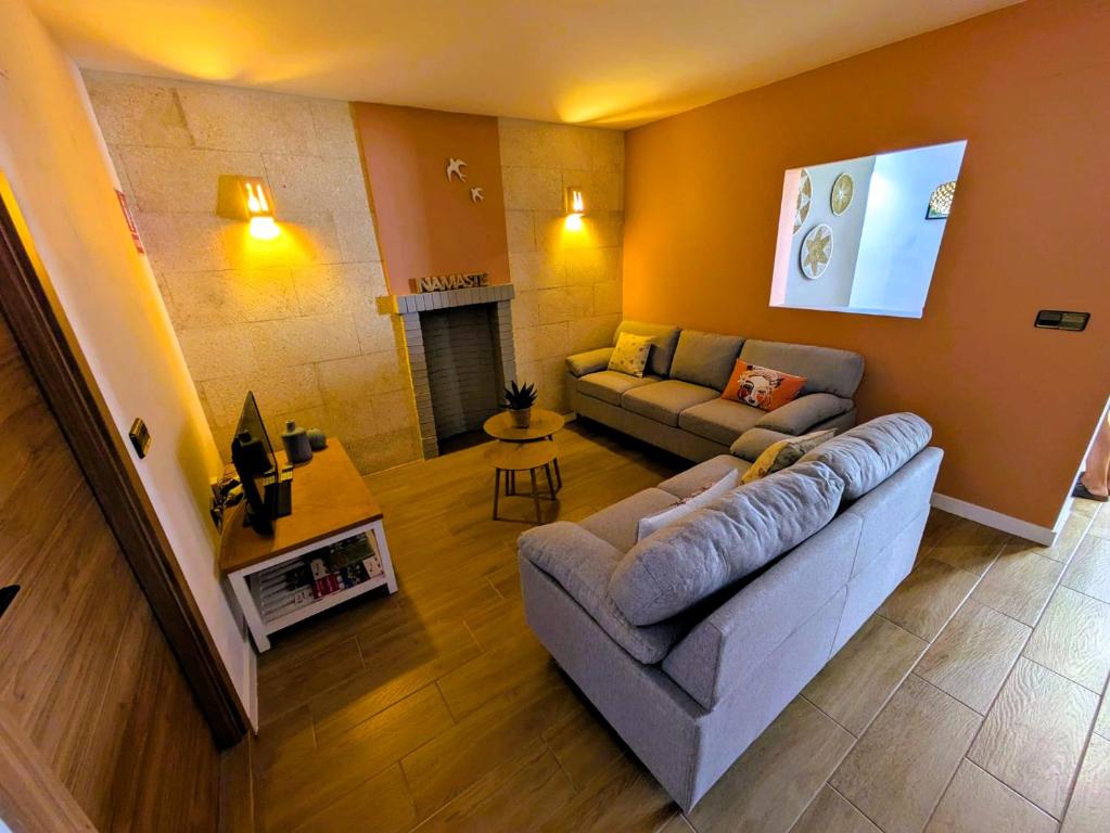 a living room with a couch and a table at Ca Amparo in Fuentes