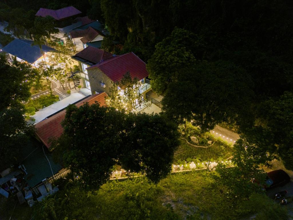 an overhead view of a yard with trees and lights at The Valley Lodge Trang An in Ninh Binh