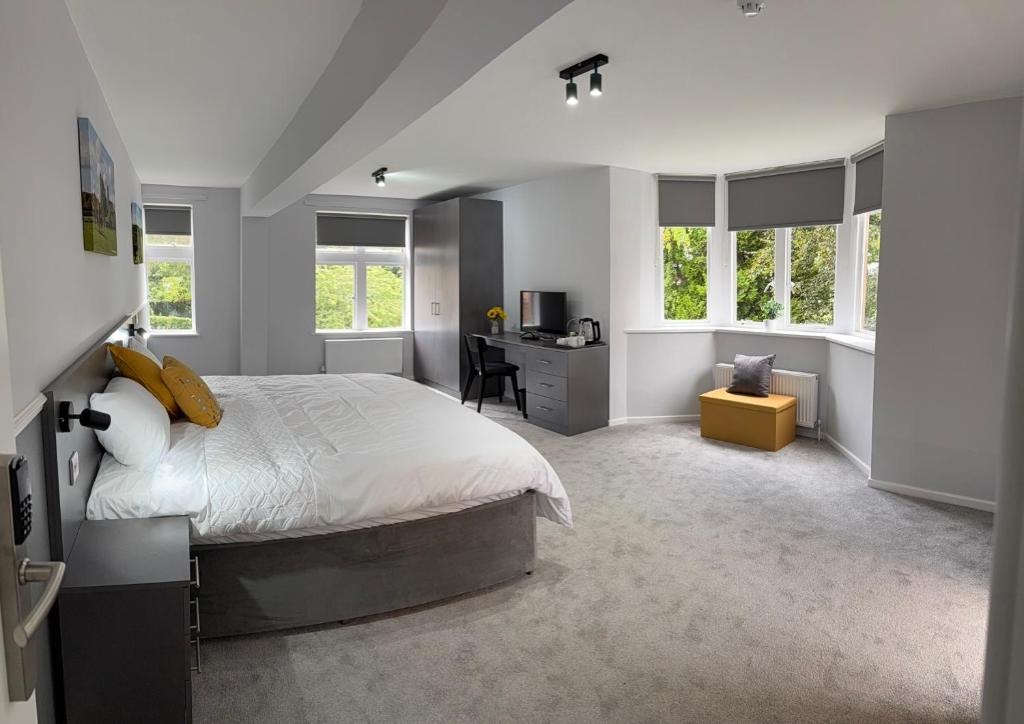 Ένα ή περισσότερα κρεβάτια σε δωμάτιο στο Porters Lodge