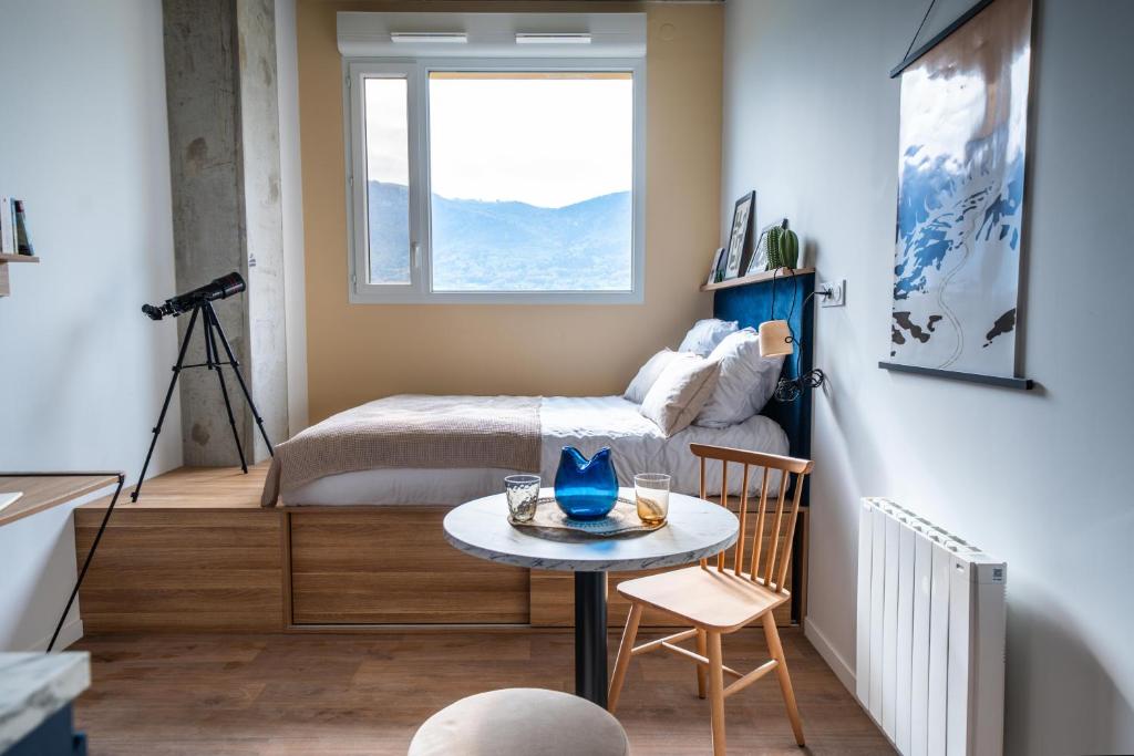 Ένα ή περισσότερα κρεβάτια σε δωμάτιο στο ECLA Genève Archamps