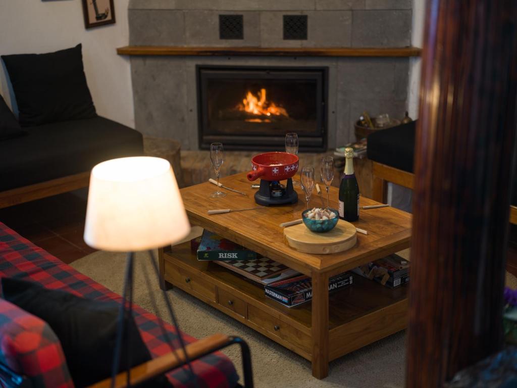 a living room with a coffee table with a fireplace at Finca Fuente Laurel in Arucas