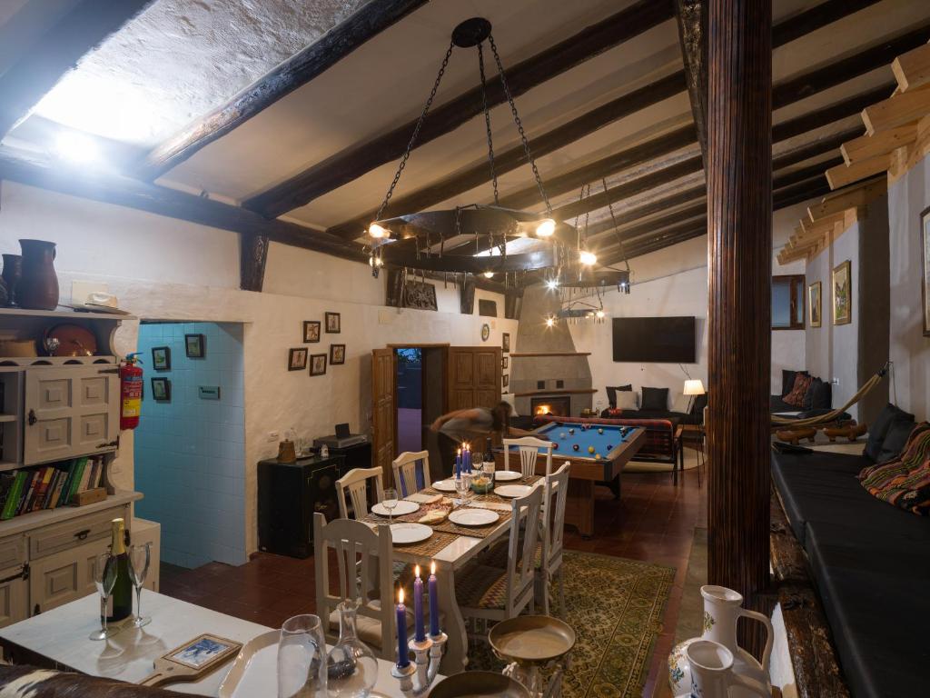 a living room with a table and a pool table at Finca Fuente Laurel in Arucas