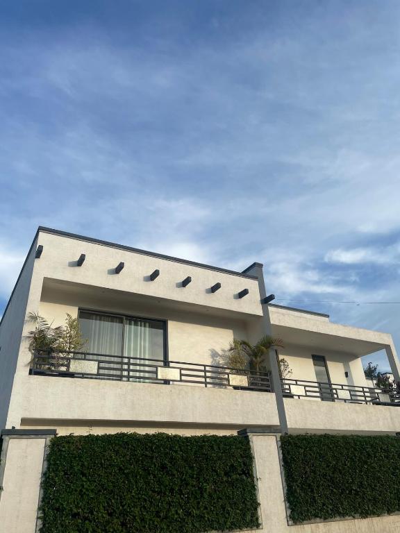 a building with a balcony on the side of it at Kantona estates in Kigali