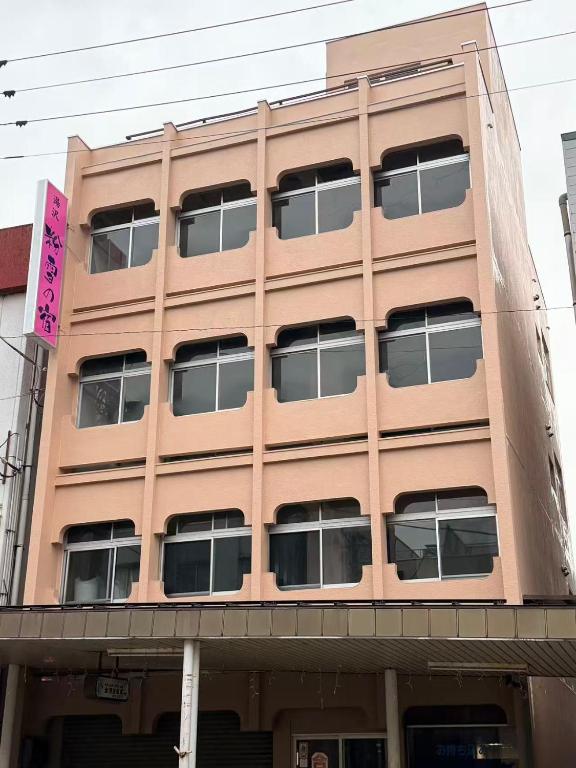 a large building with windows on the side of it at 湯沢粉雪の宿 in Yuzawa