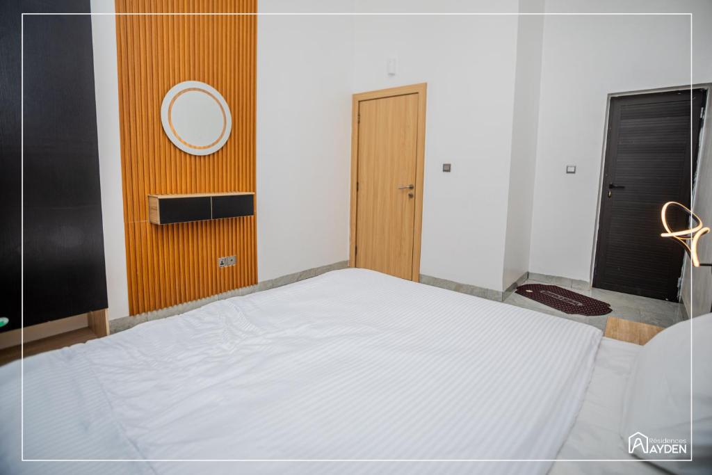 Ένα ή περισσότερα κρεβάτια σε δωμάτιο στο Résidence Ayden