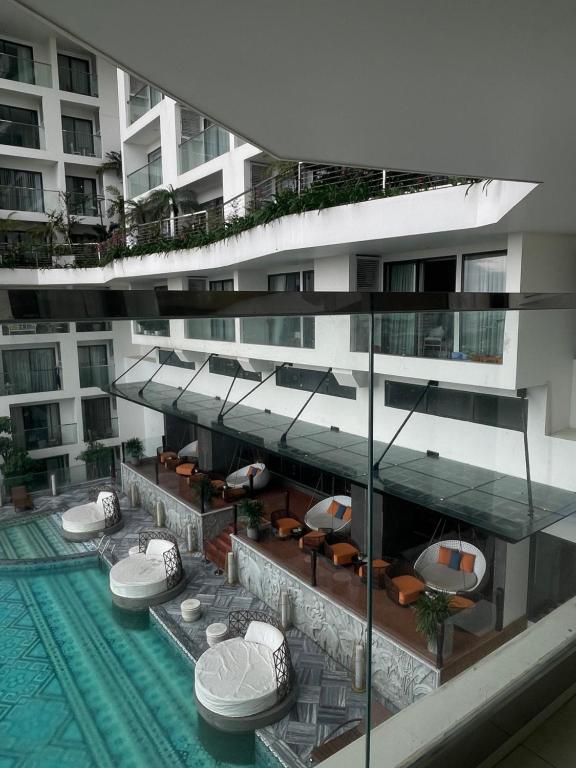 an external view of a building with a swimming pool at Yang Apec Mandala Home in Phước Hậu