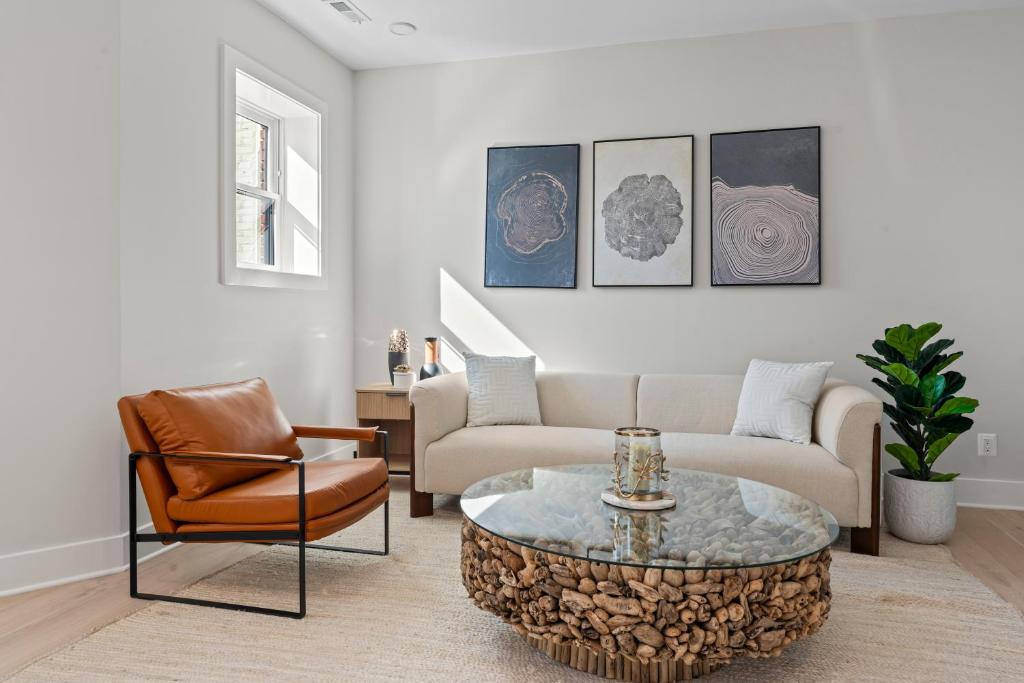 a living room with a couch and a coffee table at Lux 2BD Apartment in Dupont Circle Washington DC in Washington
