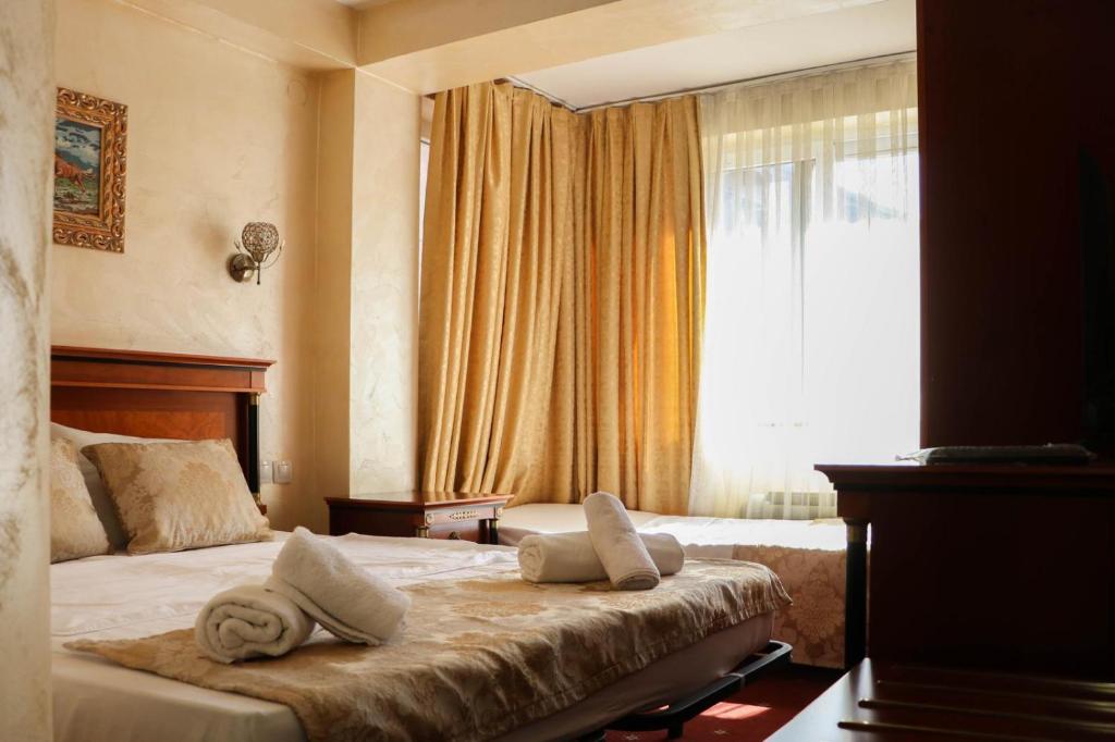 Postel nebo postele na pokoji v ubytování Angels rooms and suites by LSA