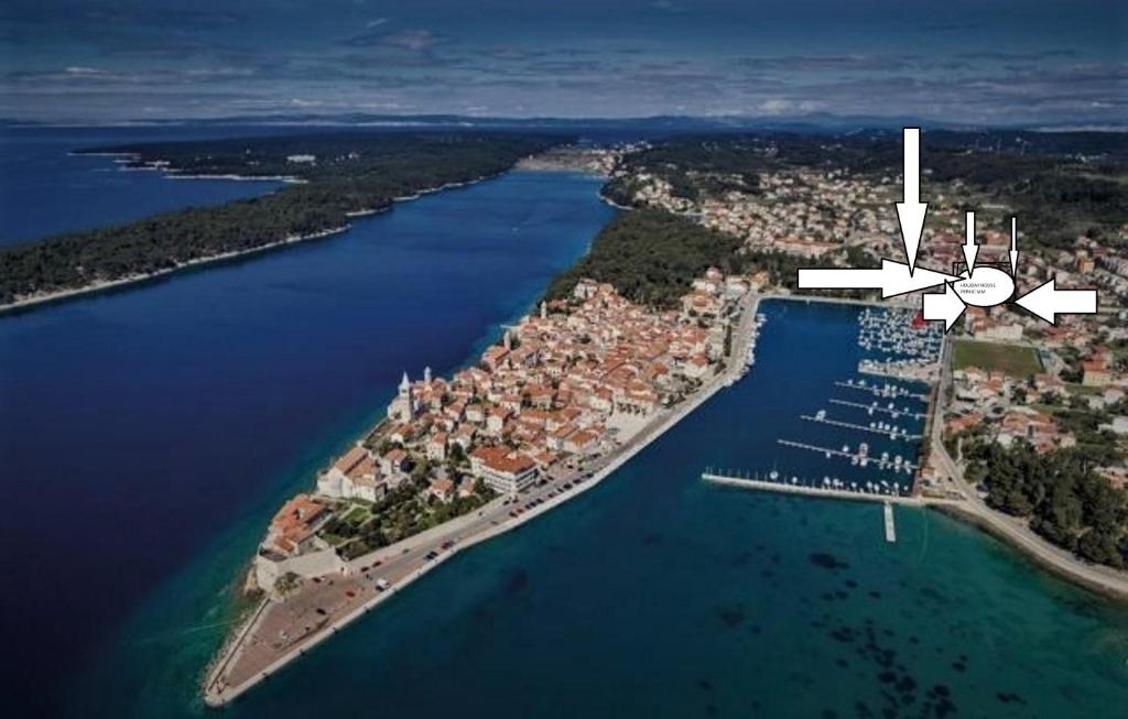 an aerial view of an island in a body of water at Mile Ferienhaus-excellent location close to Rab in Rab