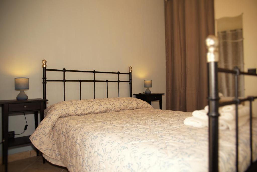 Postel nebo postele na pokoji v ubytování BnB DonnaLaura