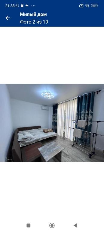 Postel nebo postele na pokoji v ubytování Флора