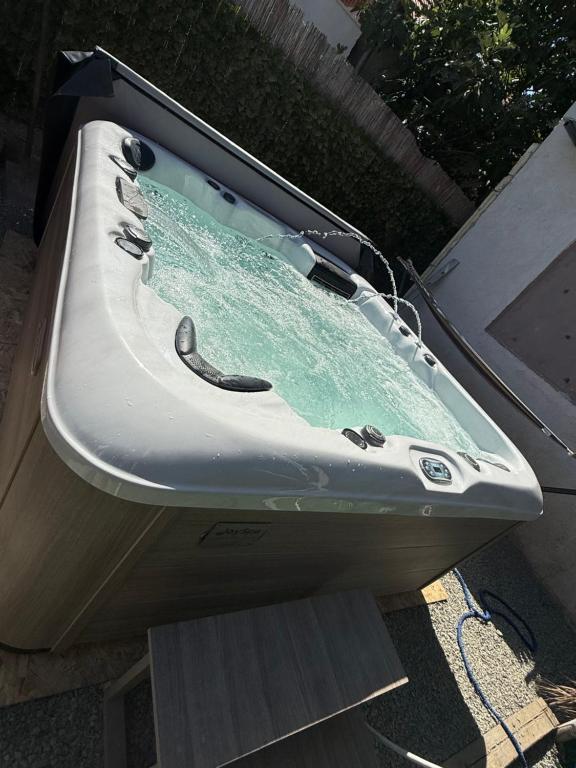 a bath tub sitting on top of a table at Casa Matei Costinești in Costinesti