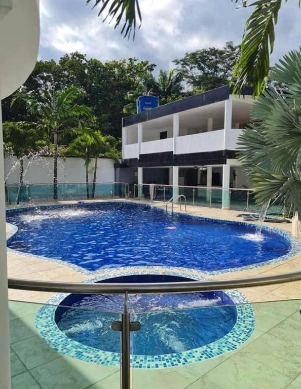 a large swimming pool in front of a building at Villa Cami in La Mata