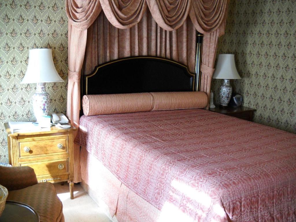 Postel nebo postele na pokoji v ubytování Hotel Majestic