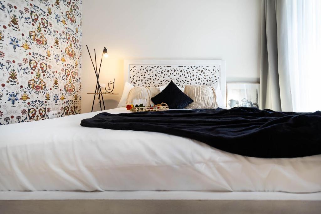 Postel nebo postele na pokoji v ubytování Sia Charm