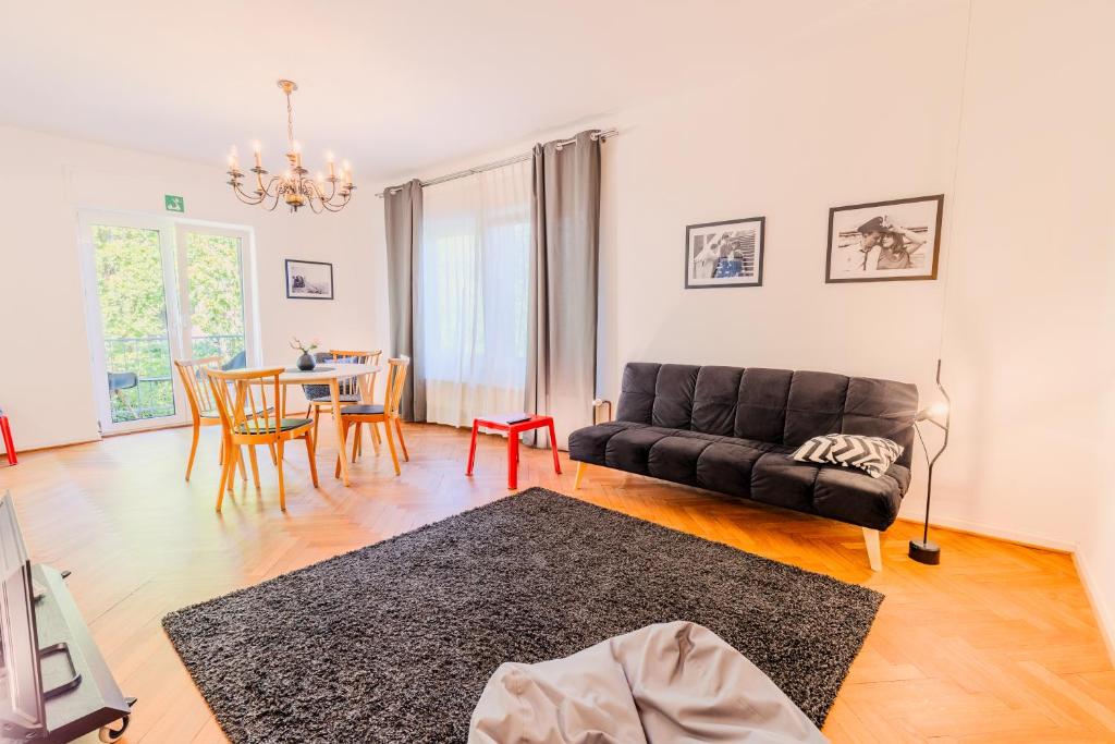 a living room with a couch and a table at SOON APT Nr 3 in Simmern