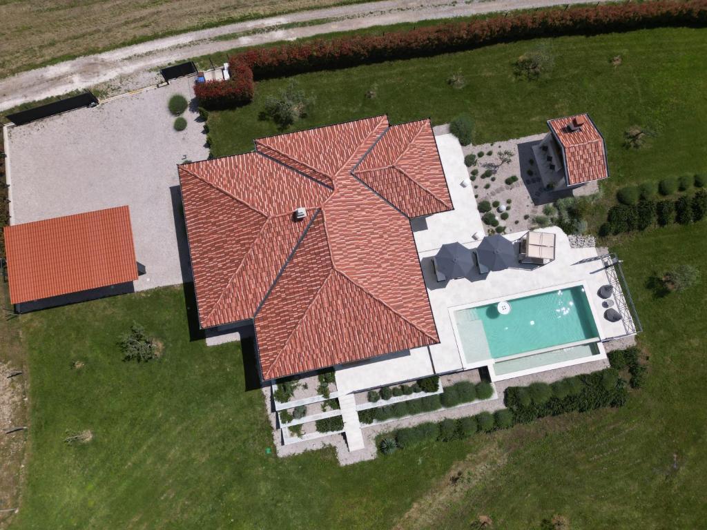 an overhead view of a house with a roof at Villa Green Forest with wellness and heated salty pool in Hum