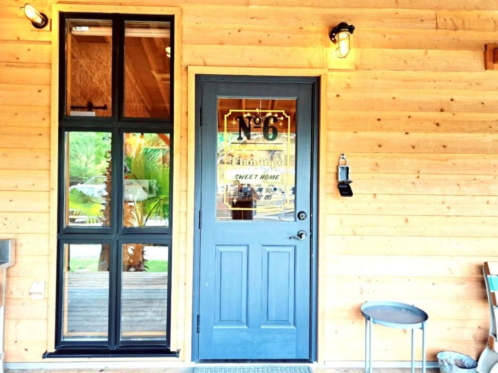 a door to a restaurant with a sign on it at Cottage Flamingo - Vacation STAY 58478v in Minato
