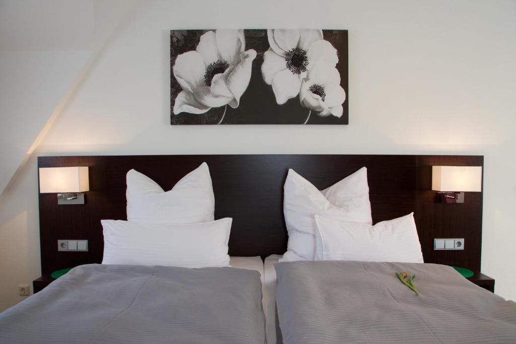 Postel nebo postele na pokoji v ubytování Hotel im Ried