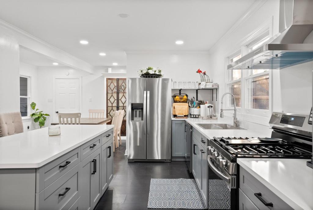 a kitchen with a stainless steel refrigerator at Blue Mountain Song- Massanutten Home with Hot tub! in Hopkins Spring