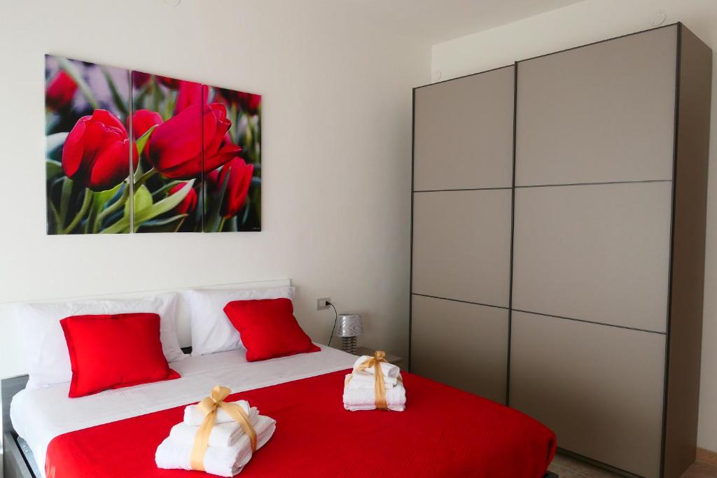 イグレージアスにあるCavallotti64のベッドルーム1室(赤と白のベッド1台、赤の枕付)