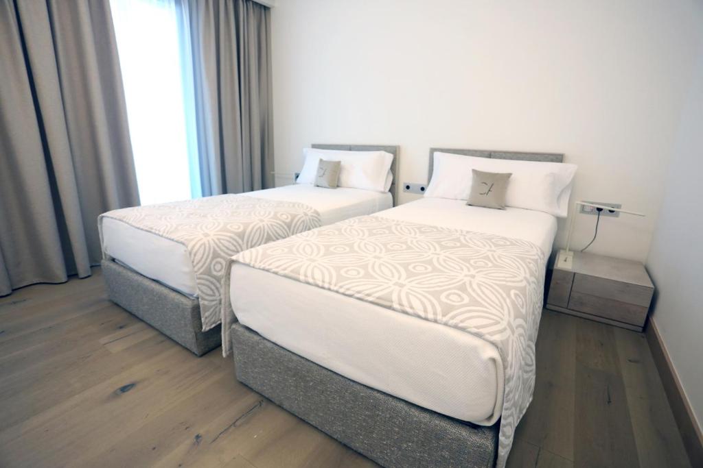 Postel nebo postele na pokoji v ubytování Cosmo Apartments Platja d'Aro