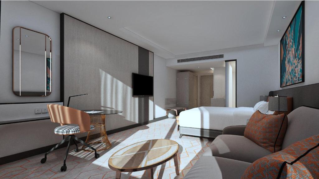 een hotelkamer met een bed en een woonkamer bij Crowne Plaza Lucknow by IHG in Lucknow