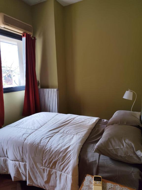 a bedroom with a bed and a window at Libertador 4 MVD in Montevideo