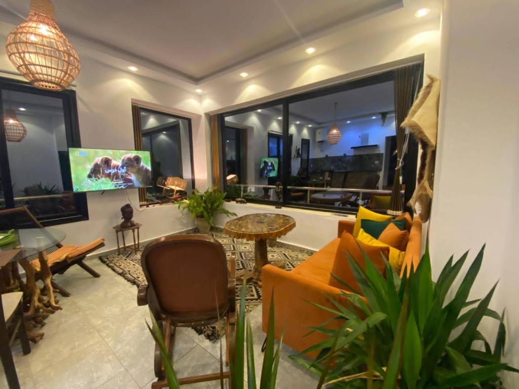 a living room with a couch and a table at Tanzania in Tabarka