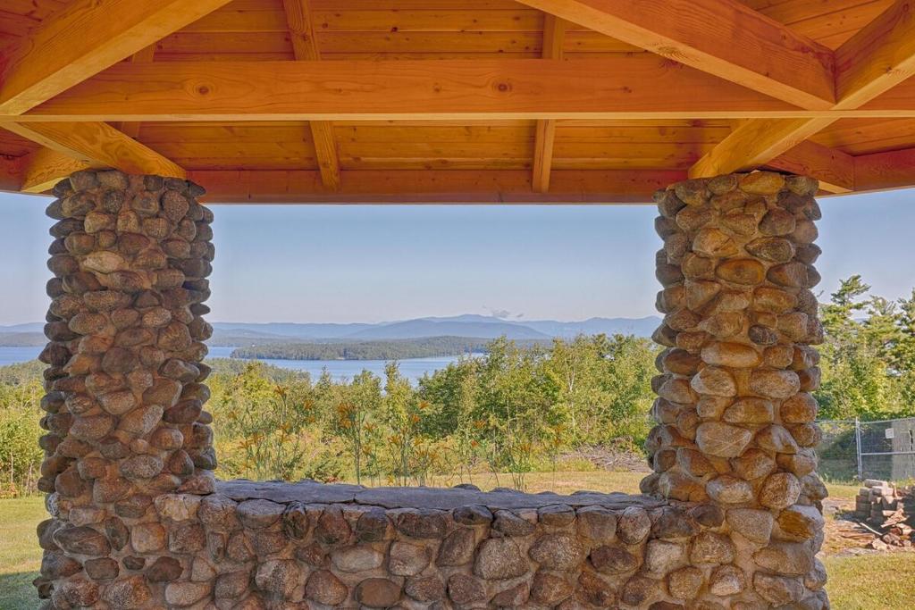 a stone wall under a wooden roof at Kimball Castle Legacy - Lake Views - Near Gunstock in Gilford
