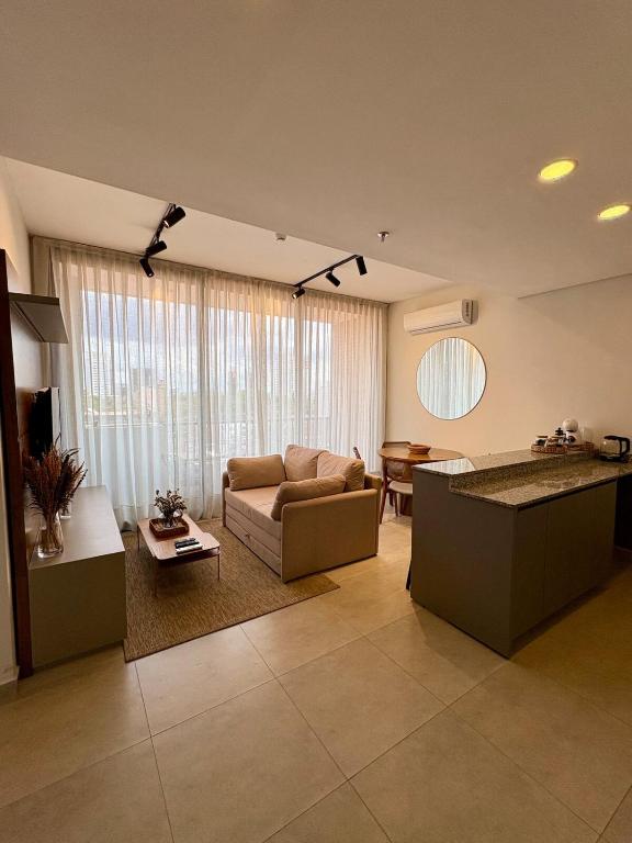 a living room with a couch and a table at Firenze 5G - Vivelite in Caña de Castilla