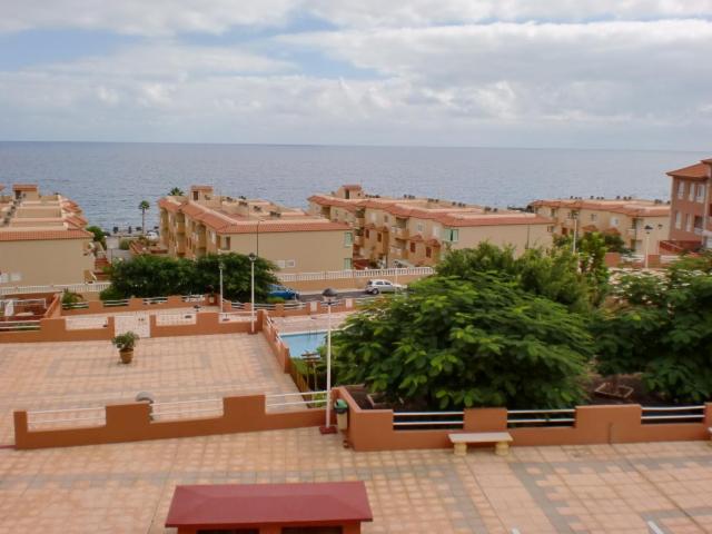 a view of a city with the ocean and buildings at Mar y Sol I Candelaria in Punta Larga