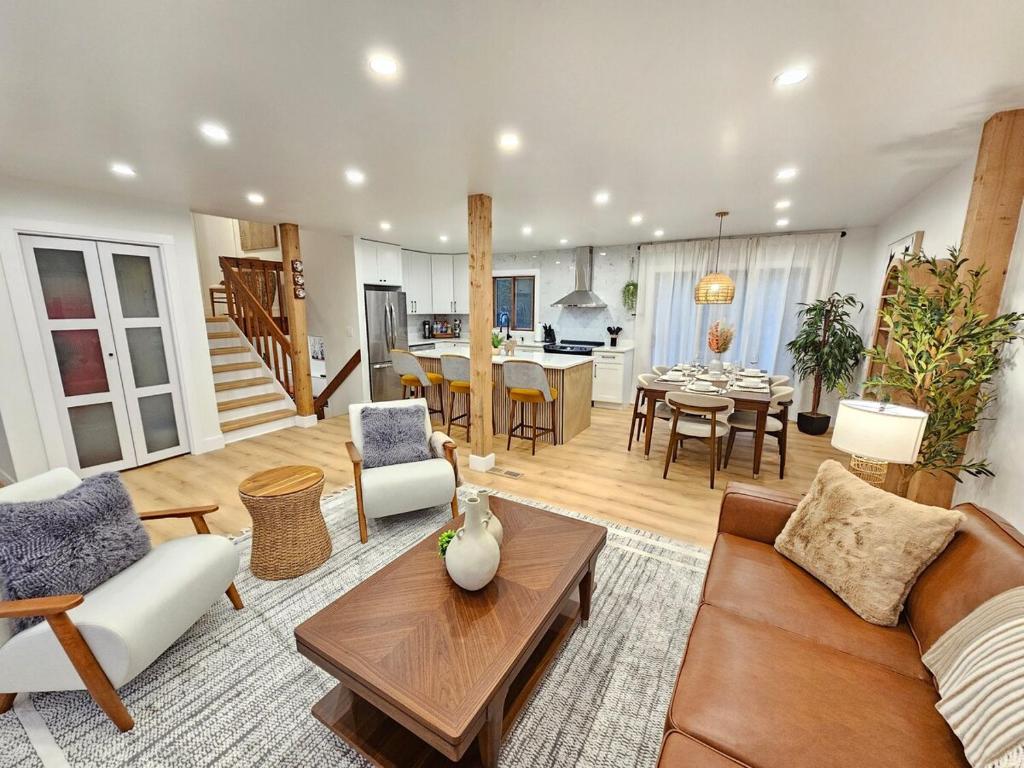 a living room with a couch and a table at Modern Retreat near Six Flags & Naval Base in Waukegan