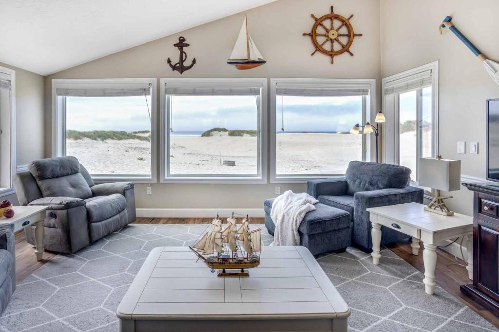 a living room with a couch and chairs and a table at Ocean Front 2BR, 2BA Home! - A Shore Thing! in Waldport