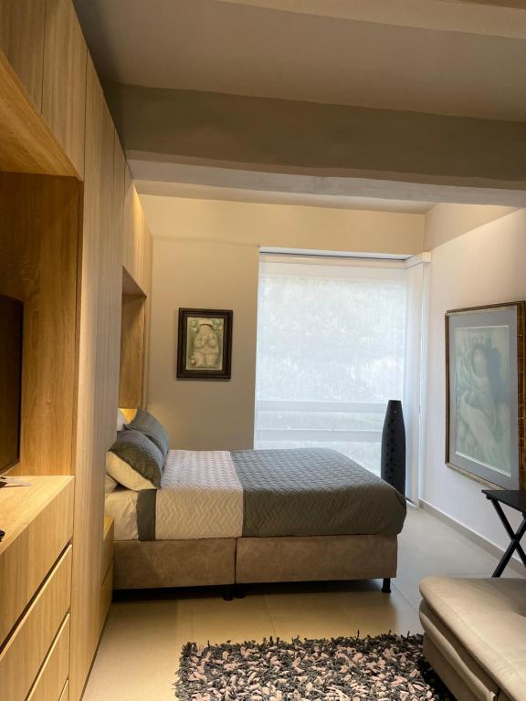 Ένα ή περισσότερα κρεβάτια σε δωμάτιο στο Moderno apartamento en North Point estudio 2