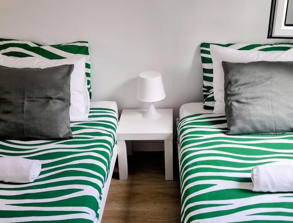 Postel nebo postele na pokoji v ubytování Studio in Alfama- Beco de São Miguel