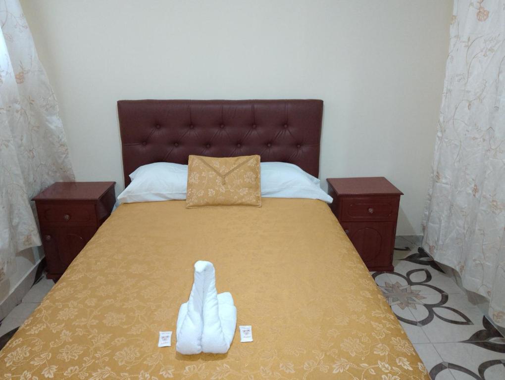 Ένα ή περισσότερα κρεβάτια σε δωμάτιο στο Hospedaje El Obraje