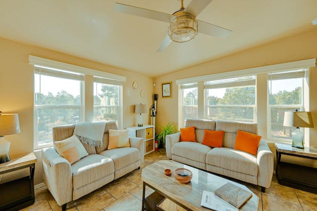 a living room with two couches and a table at Scenic Grand Canyon Hideaway 2BD Superhost in Williams